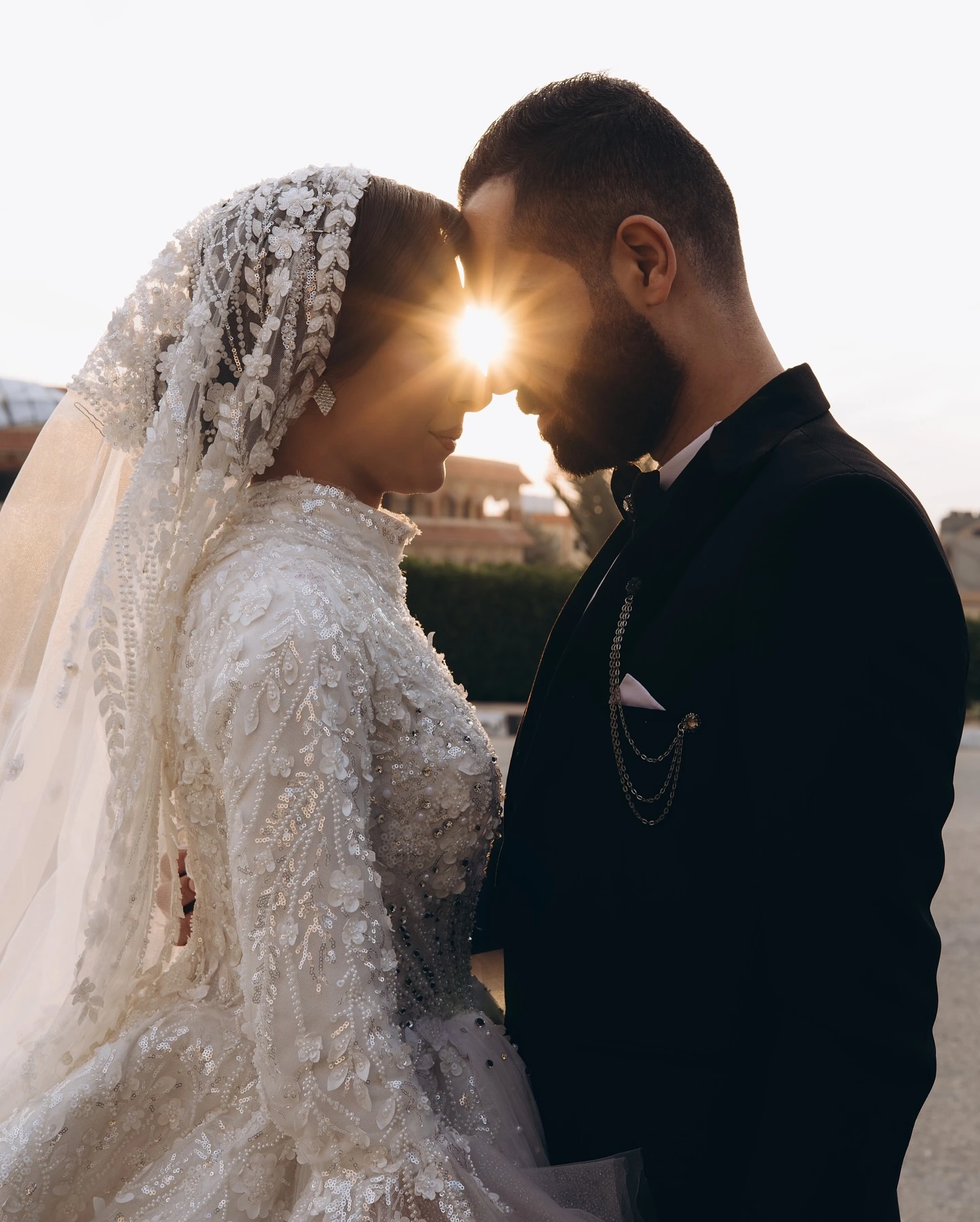 Esraa and Ahmed with the sun behind them